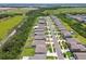 Neighborhood aerial view with manicured lawns, community landscaping, and nearby green space at 5410 Amaryllis Garden St, Apollo Beach, FL 33572