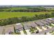 Aerial view of homes, showcasing their manicured lawns and neighborhood streets nestled amidst lush green spaces and foliage at 5410 Amaryllis Garden St, Apollo Beach, FL 33572