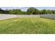 Large, well-maintained backyard featuring lush green grass and a privacy fence at 5410 Amaryllis Garden St, Apollo Beach, FL 33572