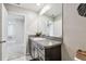 Bathroom featuring granite counters and a modern vanity offers a sleek and functional space at 5410 Amaryllis Garden St, Apollo Beach, FL 33572