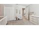 Bedroom features a crib, dresser, and closet offering a complete and serene space for a  at 5410 Amaryllis Garden St, Apollo Beach, FL 33572