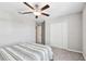 Bedroom showcasing a ceiling fan, carpet, closet, and neutral colors at 5410 Amaryllis Garden St, Apollo Beach, FL 33572