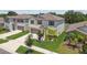 Beautiful two-story home featuring well-maintained landscaping, a two-car garage, and a charming exterior design at 5410 Amaryllis Garden St, Apollo Beach, FL 33572