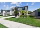 Beautiful home with a well-manicured lawn, lush landscaping and inviting curb appeal at 5410 Amaryllis Garden St, Apollo Beach, FL 33572