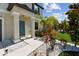 Inviting front entrance features lush landscaping and a walkway to a lovely blue door at 5410 Amaryllis Garden St, Apollo Beach, FL 33572