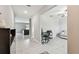 View of the open hallway leading to the living room and featuring access to the computer room at 5410 Amaryllis Garden St, Apollo Beach, FL 33572