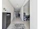 View of the light and open hallway with a shoe rack and access to the computer room at 5410 Amaryllis Garden St, Apollo Beach, FL 33572
