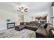 Open living area with a comfortable sectional, decorative rug, and access to the kitchen at 5410 Amaryllis Garden St, Apollo Beach, FL 33572