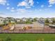 Community playground with colorful equipment, surrounded by well-maintained landscaping and neighborhood homes, a vibrant space for  at 5410 Amaryllis Garden St, Apollo Beach, FL 33572