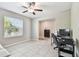 Bright room with a window and tile floor with access to the hall and another room at 5410 Amaryllis Garden St, Apollo Beach, FL 33572