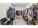 Spacious walk-in closet with ample storage and organized shelving providing a dream for clothing enthusiasts at 5410 Amaryllis Garden St, Apollo Beach, FL 33572