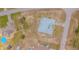 A captivating aerial view of a home featuring a metal roof and ample land, situated on a corner lot at 5432 Queen Ave, Spring Hill, FL 34609