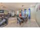Spacious dining area featuring stylish chandelier and adjacent living space at 5432 Queen Ave, Spring Hill, FL 34609