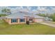 Lovely single-story home with a low maintenance yard, metal roof and attached two car garage at 5432 Queen Ave, Spring Hill, FL 34609