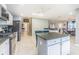 Bright kitchen with granite countertops, stainless appliances, and a view of the dining area at 5432 Queen Ave, Spring Hill, FL 34609