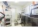 Well-equipped laundry room with tile floors, utility sink and modern washer and dryer at 5432 Queen Ave, Spring Hill, FL 34609