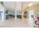 Large, open living room featuring tile flooring and a neutral color scheme at 5432 Queen Ave, Spring Hill, FL 34609