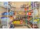 Organized pantry space with wire shelving fully stocked with lots of food items at 5432 Queen Ave, Spring Hill, FL 34609