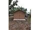 A modest and functional shed in a backyard setting provides practical outdoor storage at 5535 Peach Ave, Seffner, FL 33584