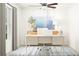 Bright home office featuring a ceiling fan, modern desk, and stylish decor at 6508 Propel Run, New Port Richey, FL 34655