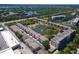 Scenic aerial view of the condo community, featuring a central lake and lush surroundings at 8181 Eagles Park N Dr, St Petersburg, FL 33709
