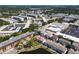 Wide aerial shot displays the condo complex, close to parking and recreational areas at 8181 Eagles Park N Dr, St Petersburg, FL 33709