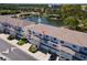 Beautiful aerial view highlighting townhome complex with lake, fountain, and manicured grounds at 8181 Eagles Park N Dr, St Petersburg, FL 33709