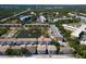 Aerial view of community near pond, highlighting attractive landscaping and nearby buildings at 8181 Eagles Park N Dr, St Petersburg, FL 33709