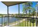 Enjoy serene lake views from this screened balcony, perfect for relaxing and unwinding at 8181 Eagles Park N Dr, St Petersburg, FL 33709