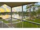 Relax on the balcony with stunning views of the community lake and sunset skies at 8181 Eagles Park N Dr, St Petersburg, FL 33709