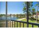 Picturesque balcony view of a tranquil lake with a fountain, surrounded by lush greenery and pathways at 8181 Eagles Park N Dr, St Petersburg, FL 33709