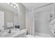 Well-lit bathroom with white fixtures, a shower/tub combo, and clean, neutral decor at 8181 Eagles Park N Dr, St Petersburg, FL 33709