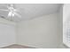 Bedroom showcasing a ceiling fan, closet, and bright window at 8181 Eagles Park N Dr, St Petersburg, FL 33709