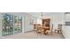 Bright dining room with natural light, table set, and outdoor views at 8181 Eagles Park N Dr, St Petersburg, FL 33709
