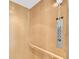 Interior of residential elevator features a wooden handrail and controls for easy operation at 8181 Eagles Park N Dr, St Petersburg, FL 33709