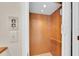 Residential elevator with a wood paneled interior offering a convenient way to access different floors at 8181 Eagles Park N Dr, St Petersburg, FL 33709