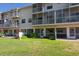 Exterior view of the building showcasing well-maintained lawns and a backyard at 8181 Eagles Park N Dr, St Petersburg, FL 33709