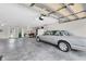 Spacious three-car garage featuring bright lighting, workbench, and ample storage space at 8181 Eagles Park N Dr, St Petersburg, FL 33709