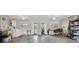 Large garage with laundry area, storage shelves, and access to the backyard at 8181 Eagles Park N Dr, St Petersburg, FL 33709