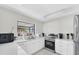 Bright kitchen with white cabinetry, stainless steel appliances, and a view overlooking outdoors at 8181 Eagles Park N Dr, St Petersburg, FL 33709