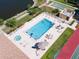 Community pool and spa area, complete with lounge chairs and well-maintained landscaping at 8181 Eagles Park N Dr, St Petersburg, FL 33709