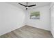 Bright bedroom with modern flooring, a ceiling fan, a closet and a window view at 8451 81St Way, Seminole, FL 33777