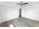 Cozy bedroom featuring a modern ceiling fan and ample closet space at 8451 81St Way, Seminole, FL 33777