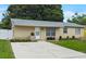 Charming single-story home with landscaped front yard and long driveway at 8451 81St Way, Seminole, FL 33777