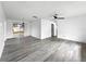 Bright living room with sliding glass door and modern ceiling fan at 8451 81St Way, Seminole, FL 33777