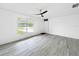 Bright living room featuring a window and modern flooring at 8451 81St Way, Seminole, FL 33777