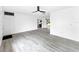 Spacious living room featuring modern flooring and a view into the kitchen at 8451 81St Way, Seminole, FL 33777