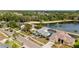 Beautiful waterfront homes on a calm lake surrounded by lush greenery at 8638 Chadwick Dr, Tampa, FL 33635
