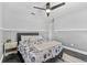 Comfortable bedroom featuring neutral colors, carpet flooring, and a ceiling fan at 8638 Chadwick Dr, Tampa, FL 33635