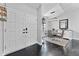 Inviting entryway leading into a dining area with elegant decor, featuring modern lighting and stylish furnishings at 8638 Chadwick Dr, Tampa, FL 33635